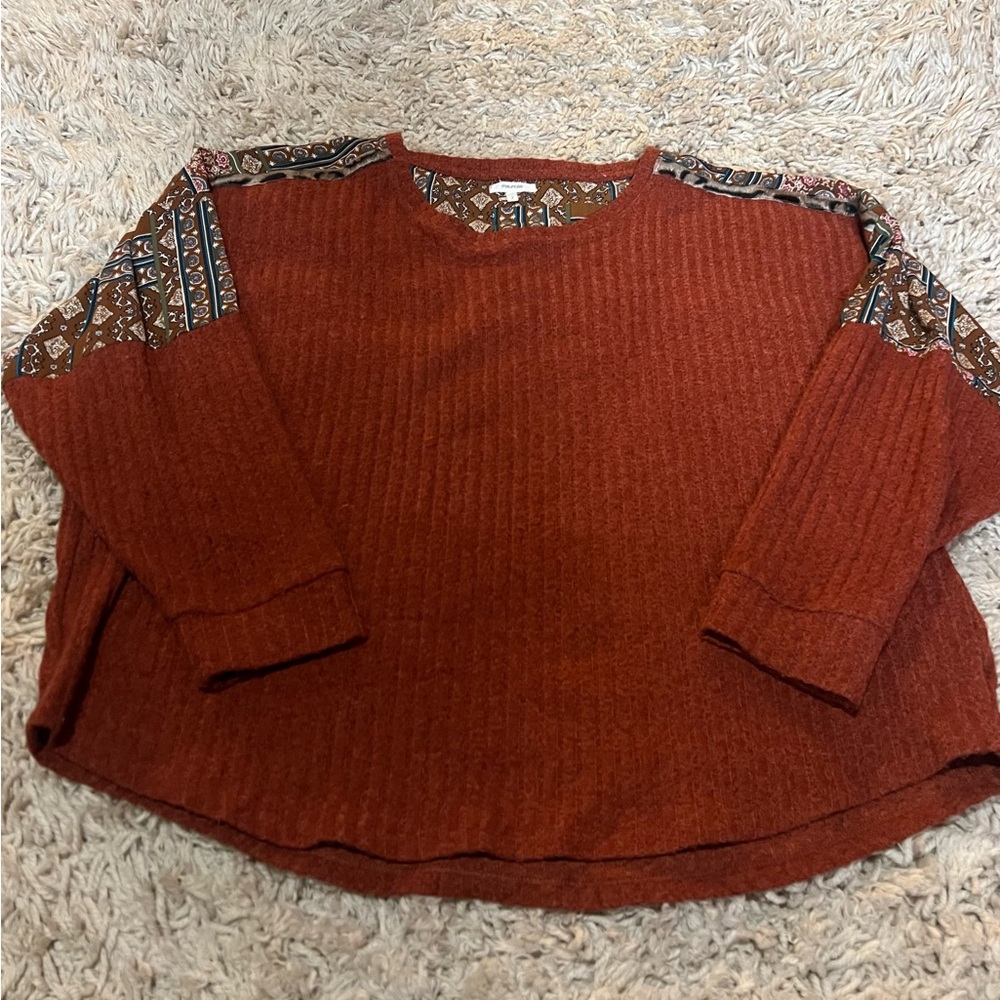 Maurice’s Rust Red Sweater with Patterned Accents